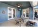 Covered patio features outdoor seating and a view of the lake at 318 Osprey Lakes Cir, Chuluota, FL 32766
