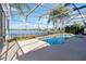 Enclosed pool with lake view at 318 Osprey Lakes Cir, Chuluota, FL 32766