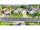 Aerial view of a cozy single-story home featuring a green front door at 3514 Forest Ridge Ln, Kissimmee, FL 34741