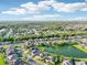 Expansive aerial view showcasing a residential community with lush landscaping and serene lakes with tree-lined streets at 3514 Forest Ridge Ln, Kissimmee, FL 34741