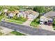 Aerial view of a single-story home with a manicured lawn and spacious driveway at 3514 Forest Ridge Ln, Kissimmee, FL 34741