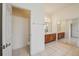 Bathroom with tiled flooring, vanity, and toilet; accessible from a nearby doorway at 3514 Forest Ridge Ln, Kissimmee, FL 34741