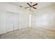 Bedroom with closet, carpet, and a ceiling fan for added comfort at 3514 Forest Ridge Ln, Kissimmee, FL 34741