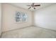 Bedroom boasts a ceiling fan, carpeted floor, neutral walls, and bright window at 3514 Forest Ridge Ln, Kissimmee, FL 34741