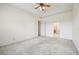 Bedroom featuring carpet, a ceiling fan, and an adjoining bathroom at 3514 Forest Ridge Ln, Kissimmee, FL 34741