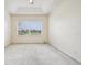 Bedroom with carpet and a ceiling fan has a large window overlooking the green landscape at 3514 Forest Ridge Ln, Kissimmee, FL 34741