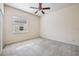 Neutral bedroom features a ceiling fan, window, carpet and natural light at 3514 Forest Ridge Ln, Kissimmee, FL 34741
