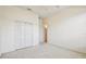 A spacious carpeted bedroom has a ceiling fan and ample closet space at 3514 Forest Ridge Ln, Kissimmee, FL 34741