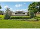 Elegant 'Crestwood' community sign amidst manicured landscaping, welcoming residents and visitors alike at 3514 Forest Ridge Ln, Kissimmee, FL 34741
