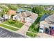 Lovely single-story home featuring a well-manicured lawn with palm trees and a spacious driveway leading to the garage at 3514 Forest Ridge Ln, Kissimmee, FL 34741