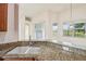 Granite counters highlight the double sink in this open kitchen with ample counter space at 3514 Forest Ridge Ln, Kissimmee, FL 34741