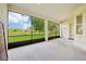 Screened lanai featuring a pond view and ample space at 3514 Forest Ridge Ln, Kissimmee, FL 34741