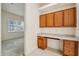 Office nook with built-in desk and storage cabinets, perfect for remote work at 3514 Forest Ridge Ln, Kissimmee, FL 34741