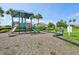 Community playground area includes slides and a climbing structure with benches and a landscaped green area at 3514 Forest Ridge Ln, Kissimmee, FL 34741