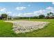 Community sand volleyball court with net for sports and recreation at 3514 Forest Ridge Ln, Kissimmee, FL 34741
