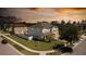 Sunset aerial view of home with a large lot, fenced yard, and lush landscaping at 3556 Cheswick Dr, Ocoee, FL 34761