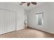 Bedroom featuring hardwood floors, a window, and double closet, offering ample storage space and natural light at 3912 Avalon Park West Blvd, Orlando, FL 32828