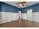 Spacious bedroom with a ceiling fan, bright blue walls, and white trim provides a relaxing atmosphere at 3912 Avalon Park West Blvd, Orlando, FL 32828
