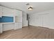 Bright bonus room features beautiful laminate flooring, built-in shelves, and a closet for extra storage at 3912 Avalon Park West Blvd, Orlando, FL 32828