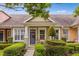 Charming townhome featuring a well-manicured lawn, covered front porch and beautiful curb appeal at 3912 Avalon Park West Blvd, Orlando, FL 32828