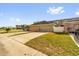 Two car garage is attached to the home with a driveway and grassy area at 3912 Avalon Park West Blvd, Orlando, FL 32828