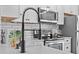 Close up of kitchen featuring stainless steel appliances and white countertops at 3912 Avalon Park West Blvd, Orlando, FL 32828