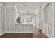 Open-concept living room featuring hardwood floors, accent walls, and modern lighting fixtures at 3912 Avalon Park West Blvd, Orlando, FL 32828