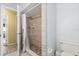 Bathroom featuring tiled shower and neutral-toned walls at 400 Woodview Dr, Longwood, FL 32779