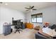 Bedroom with desk and chair, ceiling fan, and window offering natural light at 400 Woodview Dr, Longwood, FL 32779