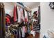 Walk-in closet with rods for hanging clothes and shelves for folded items at 400 Woodview Dr, Longwood, FL 32779