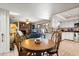 Cozy dining area with a wood table, views to the living room, and access to the kitchen at 400 Woodview Dr, Longwood, FL 32779