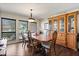 Elegant dining room with wood floors, large windows, and a built-in china cabinet at 400 Woodview Dr, Longwood, FL 32779