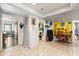 Versatile living area with tile flooring, laundry nook, and access to other rooms at 400 Woodview Dr, Longwood, FL 32779