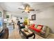 Comfortable living room with tile flooring, a ceiling fan, and neutral decor at 400 Woodview Dr, Longwood, FL 32779