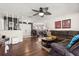 Spacious living room featuring hardwood floors, a ceiling fan, and an open layout at 400 Woodview Dr, Longwood, FL 32779