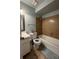 Bathroom showing toilet, tub, and vanity with white fixtures and blue walls at 402 Dorchester Sq, Lake Mary, FL 32746