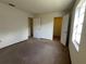 Bedroom featuring neutral carpet and multiple doorways, providing ample space at 402 Dorchester Sq, Lake Mary, FL 32746