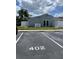 Rear view of home with parking and grassy area at 402 Dorchester Sq, Lake Mary, FL 32746