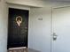 Front door of unit 402 with a gold wreath and welcome sign at 402 Dorchester Sq, Lake Mary, FL 32746