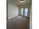 Cozy living room with sliding glass doors to the backyard at 402 Dorchester Sq, Lake Mary, FL 32746