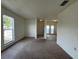 Bright living area featuring carpet and large window at 402 Dorchester Sq, Lake Mary, FL 32746