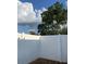 A white vinyl fence provides privacy in the patio area at 402 Dorchester Sq, Lake Mary, FL 32746