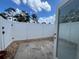 A concrete patio with white fencing and small decorative rocks at 402 Dorchester Sq, Lake Mary, FL 32746