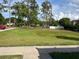 Expansive grassy area with mature trees at 402 Dorchester Sq, Lake Mary, FL 32746