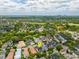 Aerial view of neighborhood, property, and nearby green spaces at 4094 Oak St, Orlando, FL 32814
