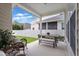 Relaxing back porch with outdoor seating and view of backyard at 4094 Oak St, Orlando, FL 32814