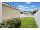 Well-maintained backyard featuring lush green grass and a white fence at 4094 Oak St, Orlando, FL 32814