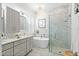 Bright bathroom features double vanity, soaking tub, and spacious walk-in shower with marble tile surround at 4094 Oak St, Orlando, FL 32814