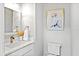 Elegant half bathroom with decorative mirror and stylish fixtures at 4094 Oak St, Orlando, FL 32814