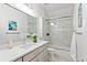 Bright bathroom features single vanity and shower and tub combination at 4094 Oak St, Orlando, FL 32814